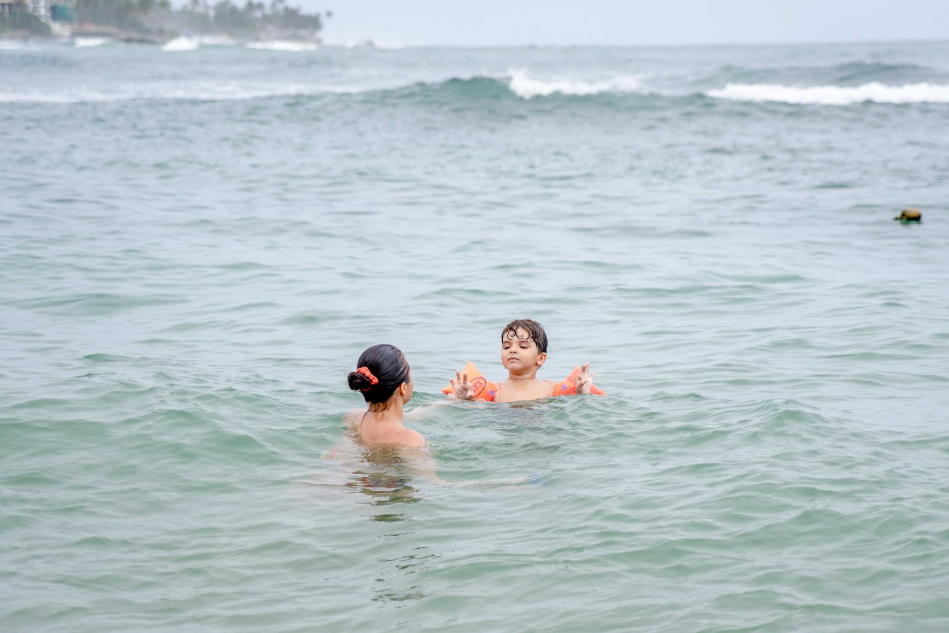 child swimming safety beach