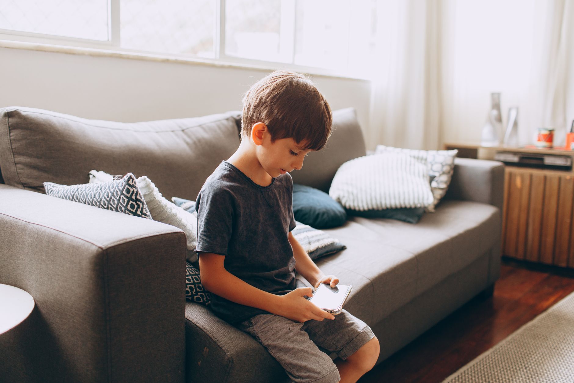 child using smartphone worried