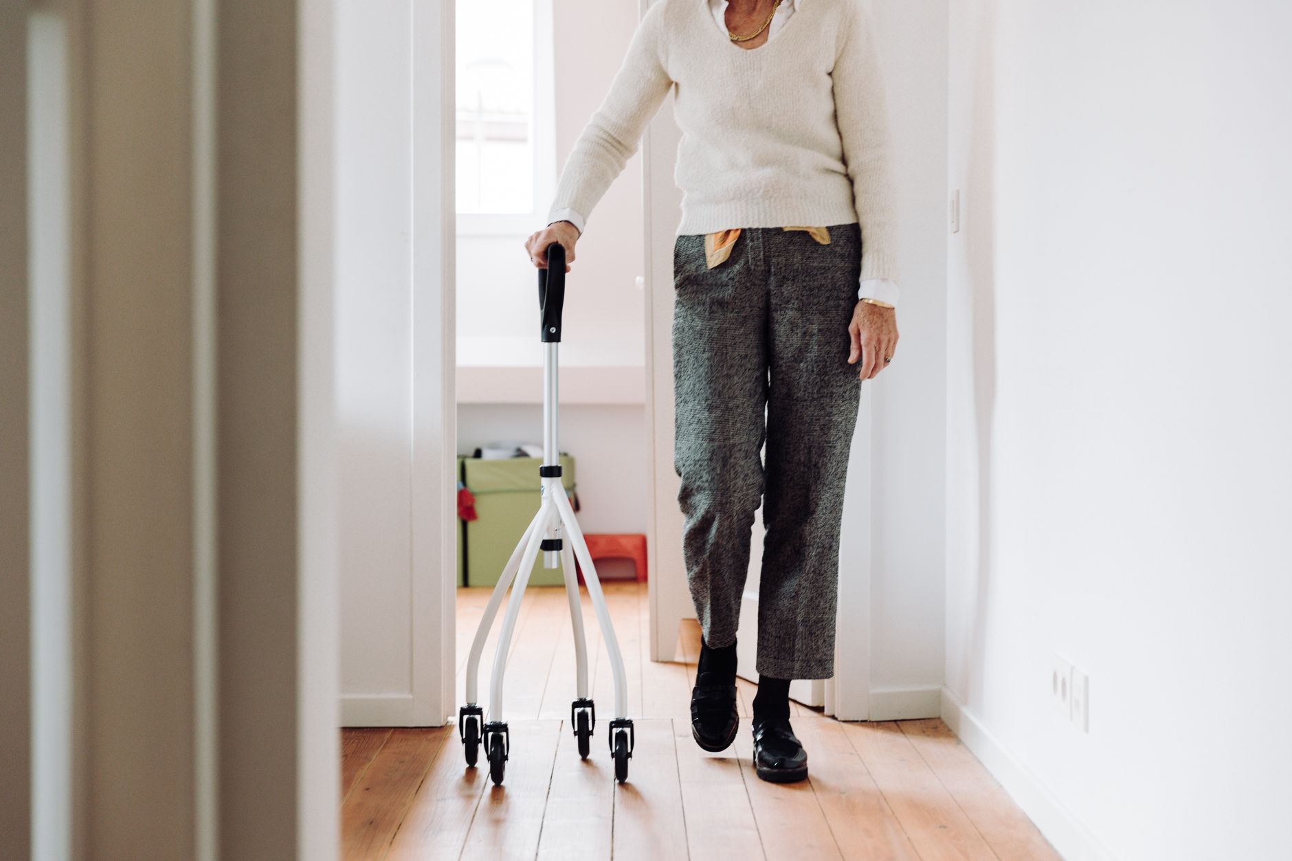 person walking with mobility support