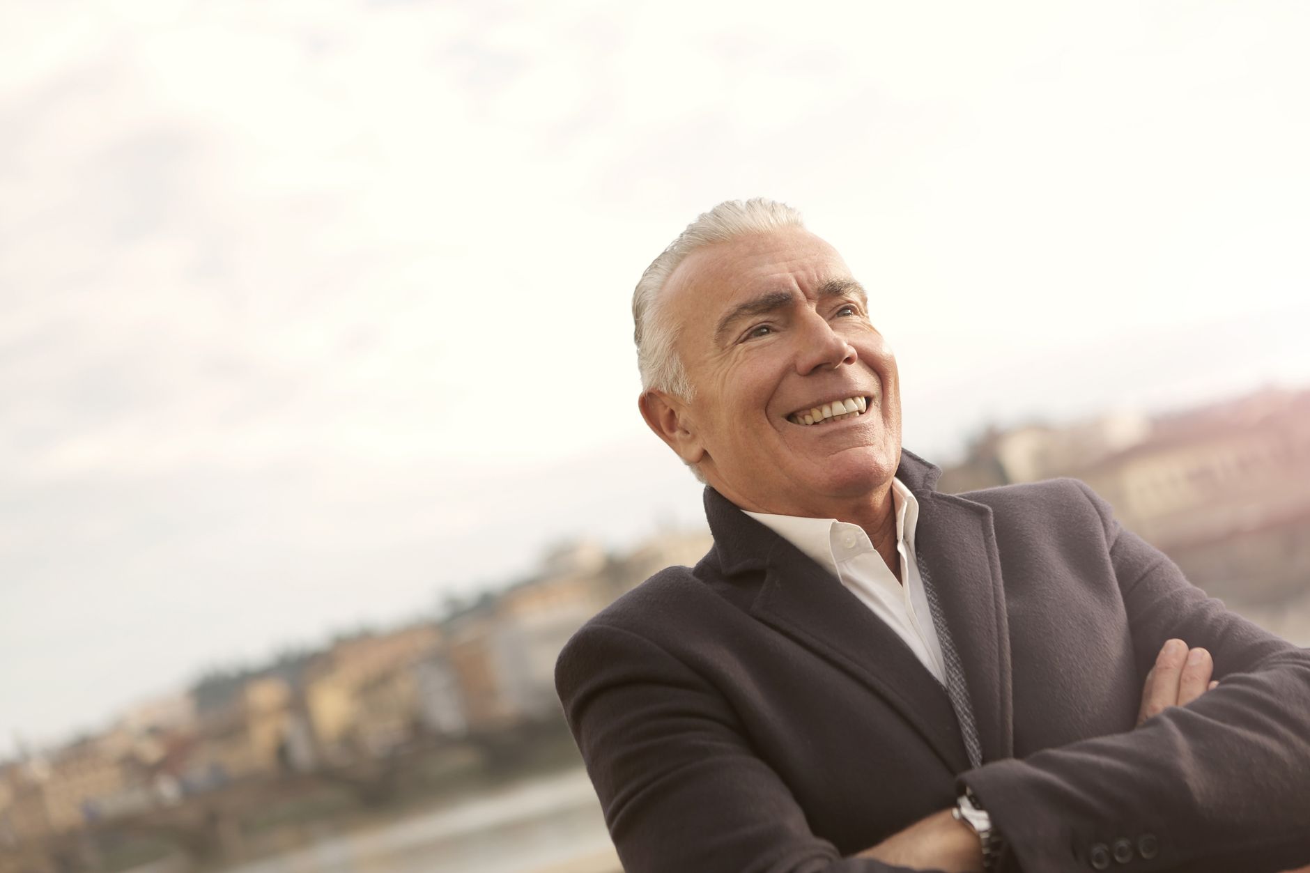 older person smiling outdoors