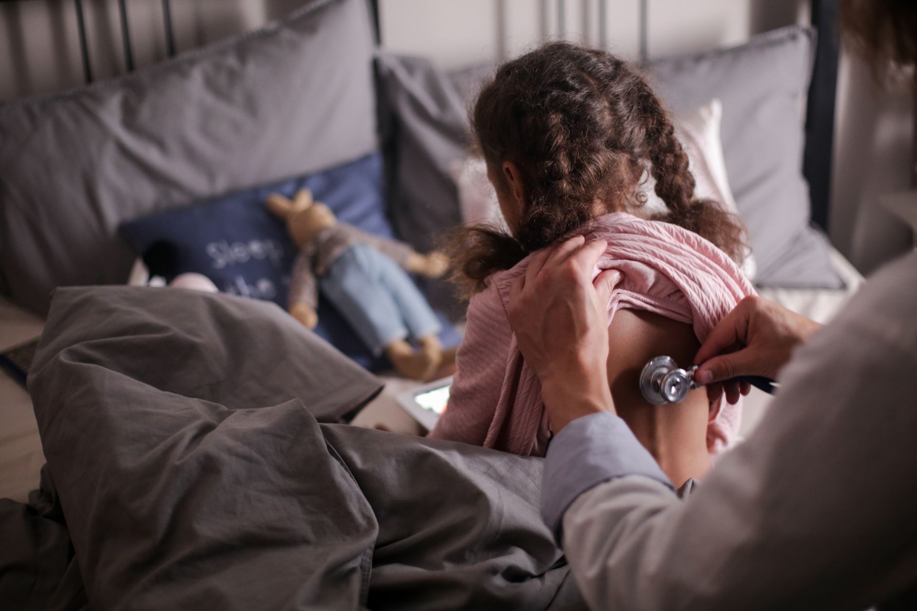 pediatrician examining child