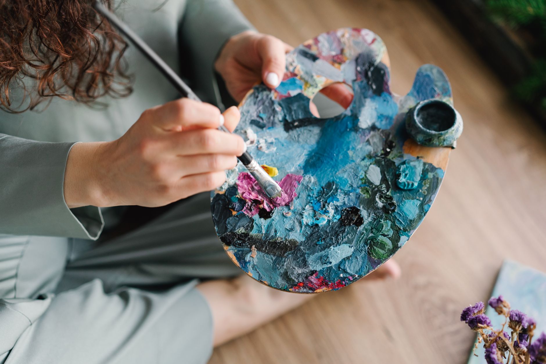 person painting art therapy