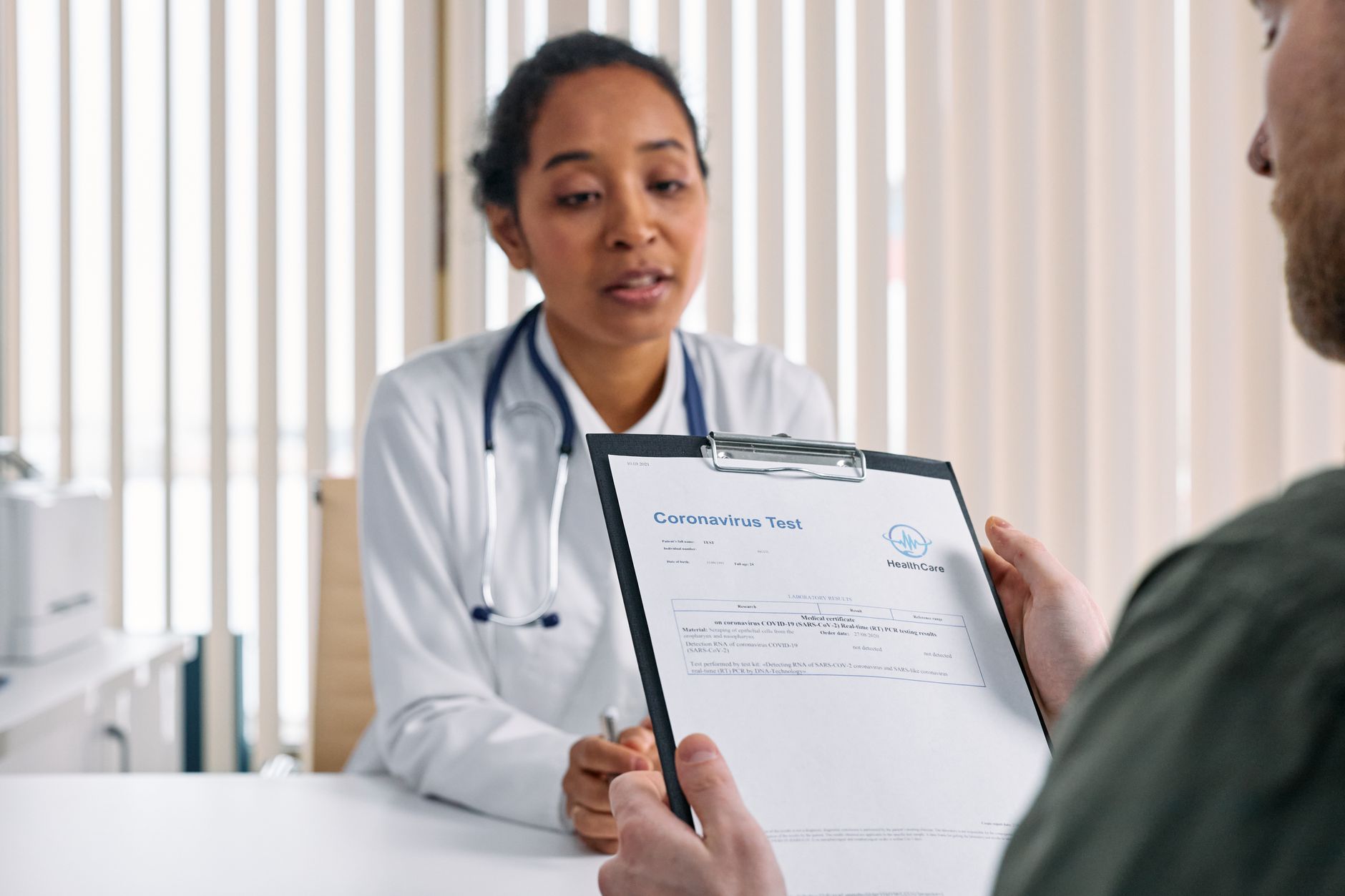 doctor discussing medical results man