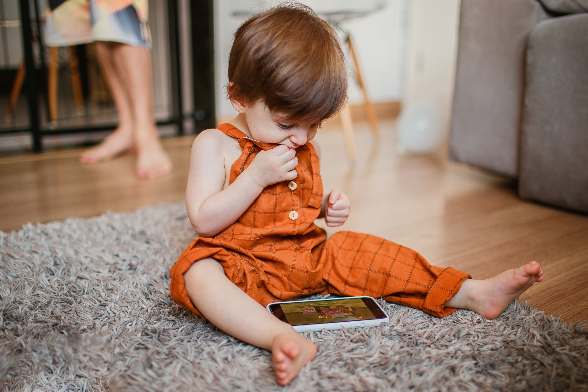 child using smartphone screen