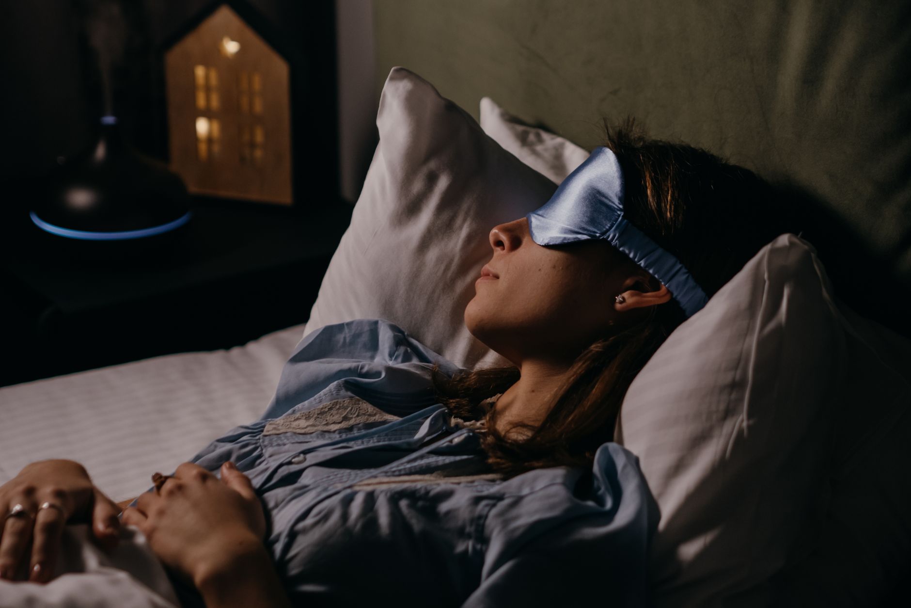 person sleeping bedroom night
