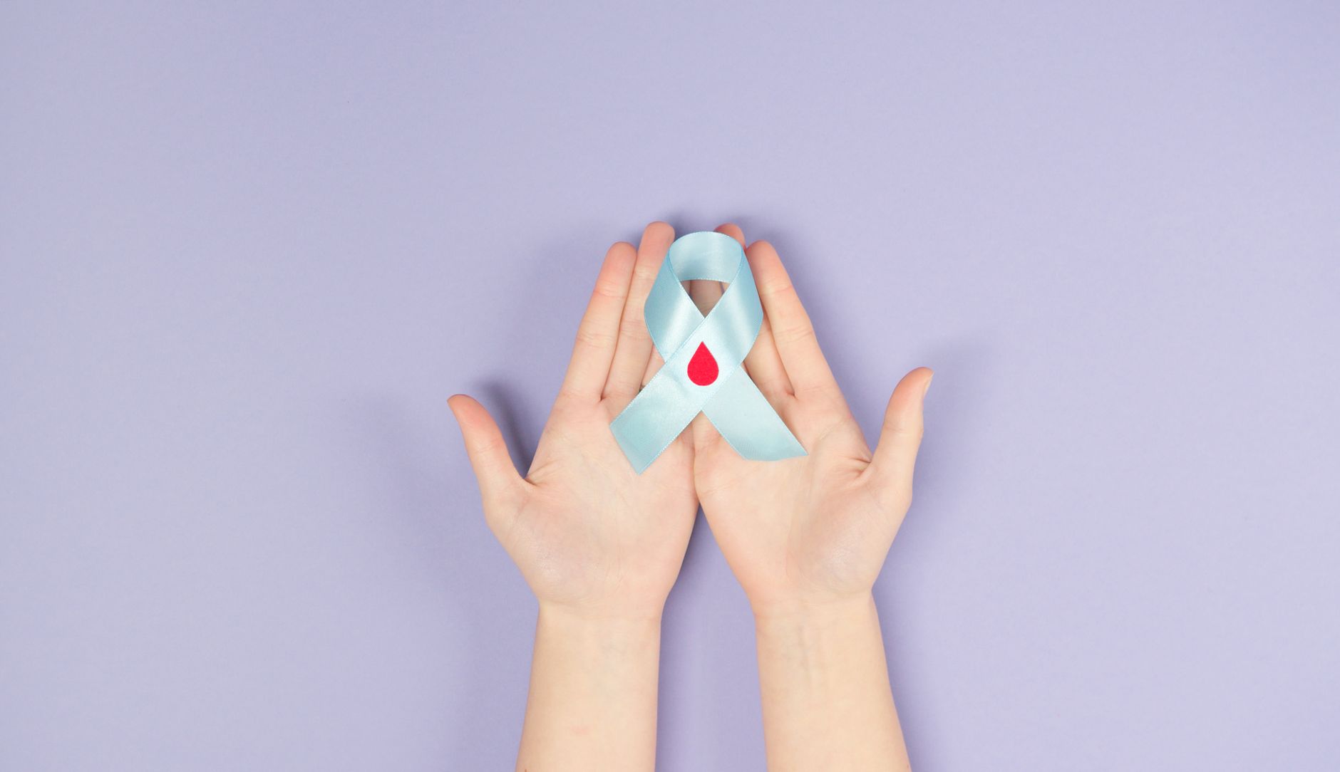 red ribbon awareness support hands