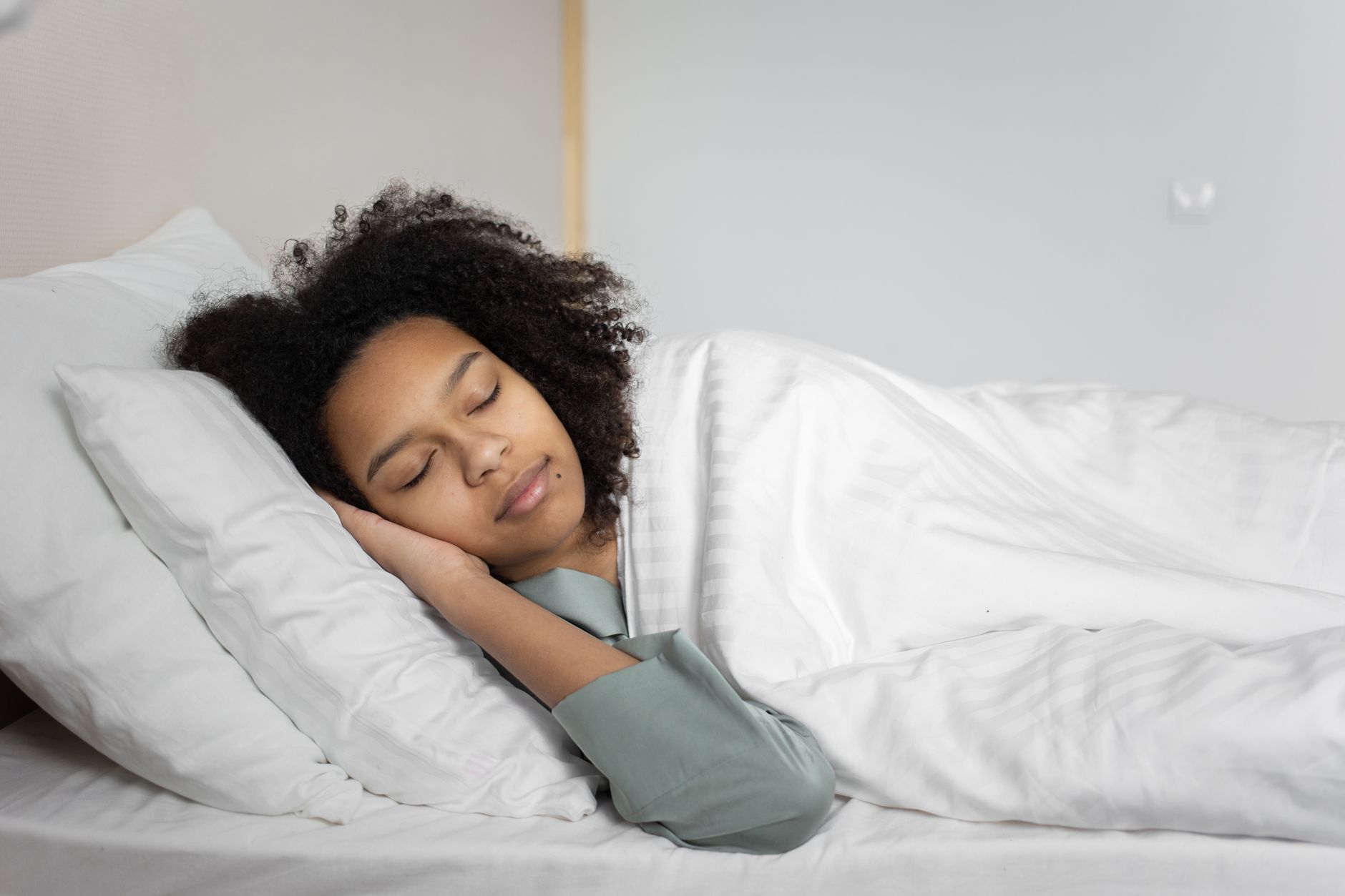 person sleeping peacefully bed