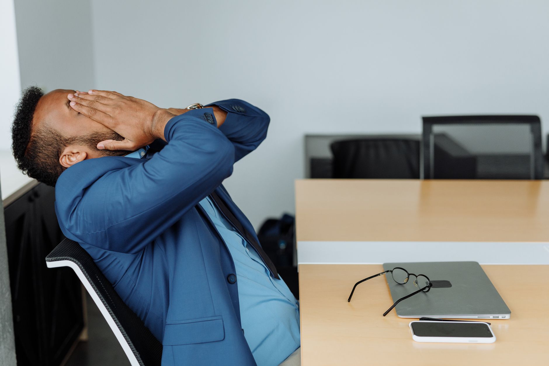 person stressed office desk
