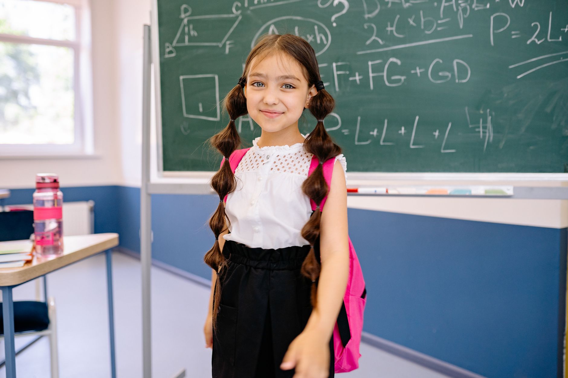 child carrying school backpack