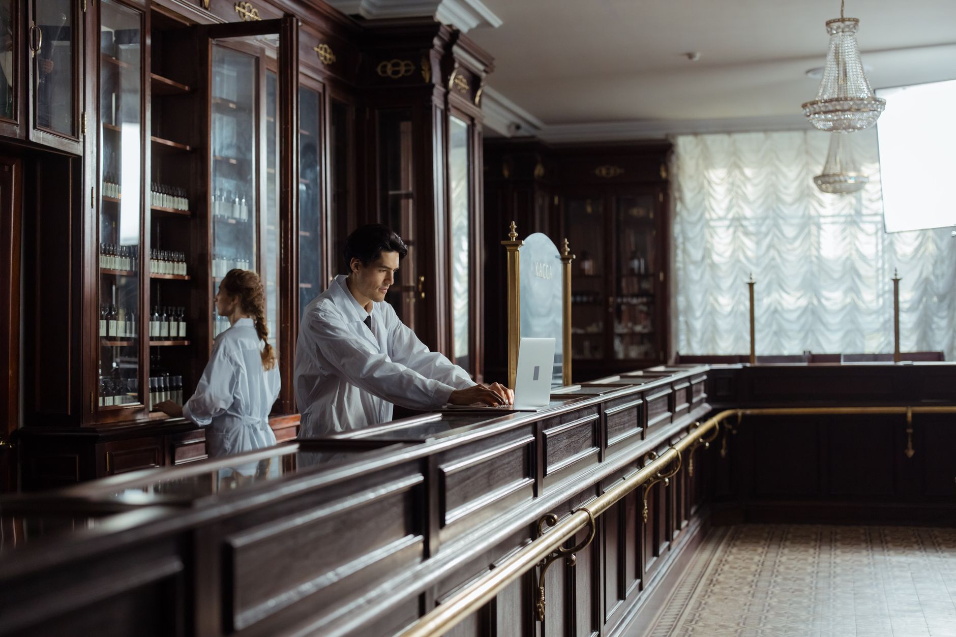 pharmacist helping customer pharmacy