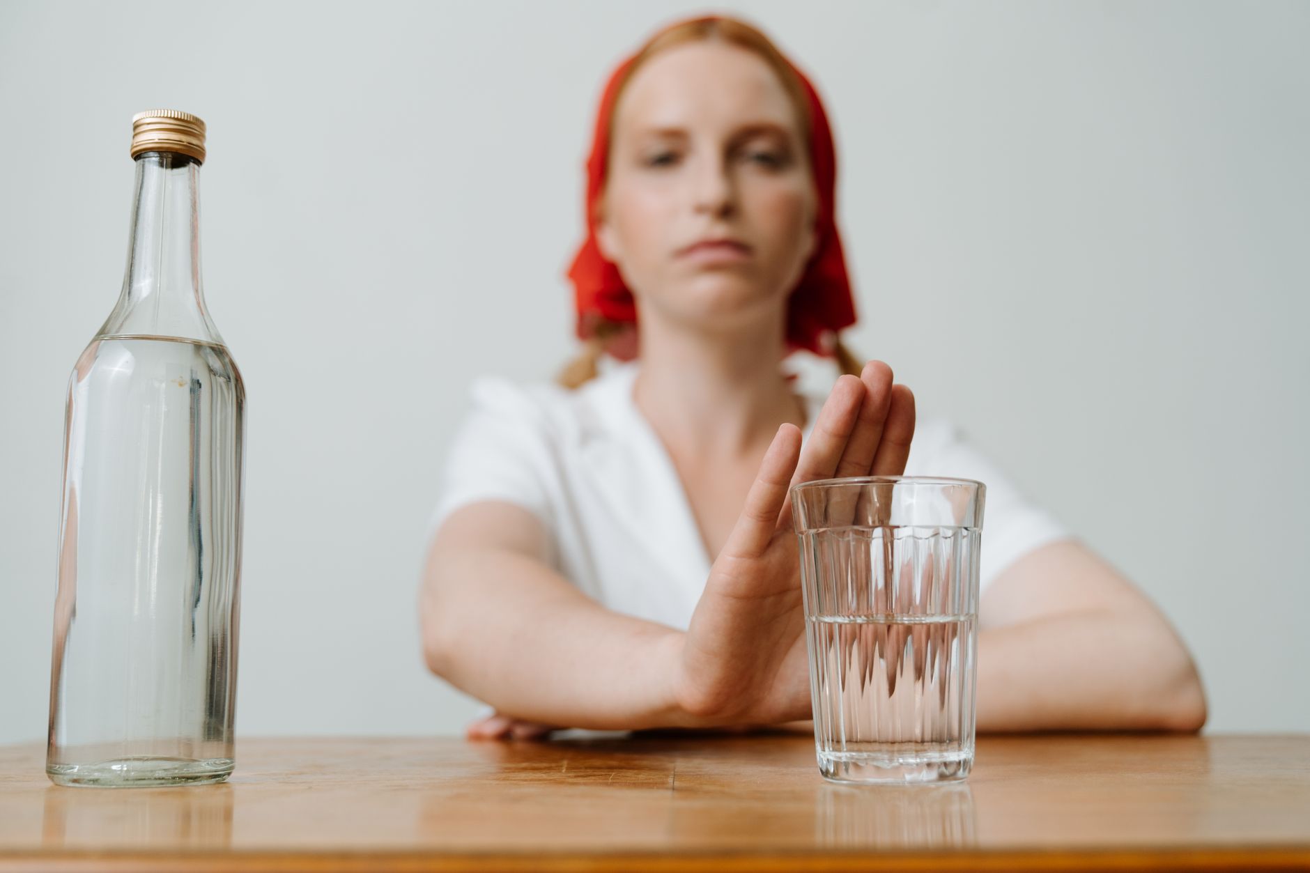 person refusing alcohol glass