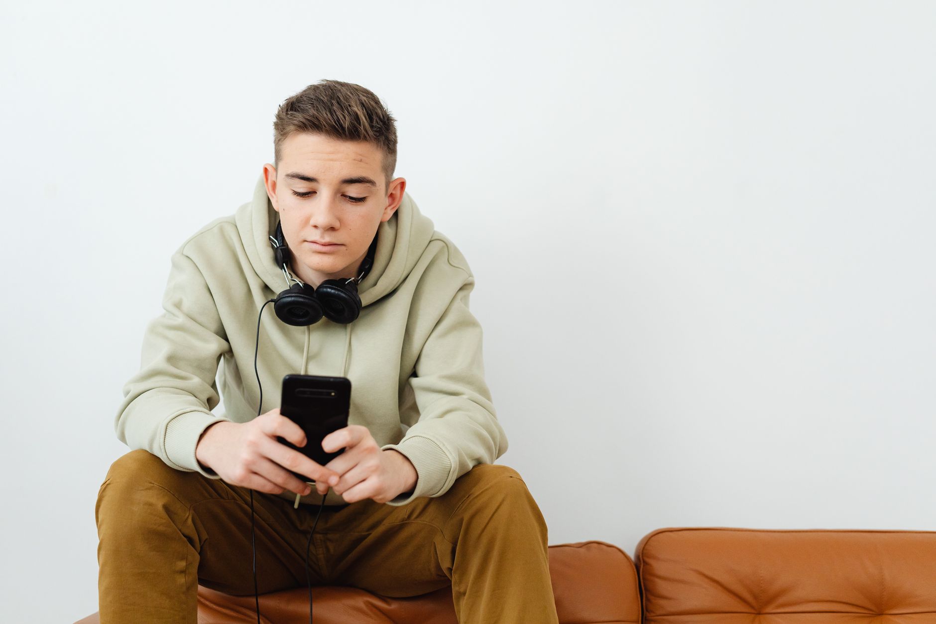 teenager using smartphone alone