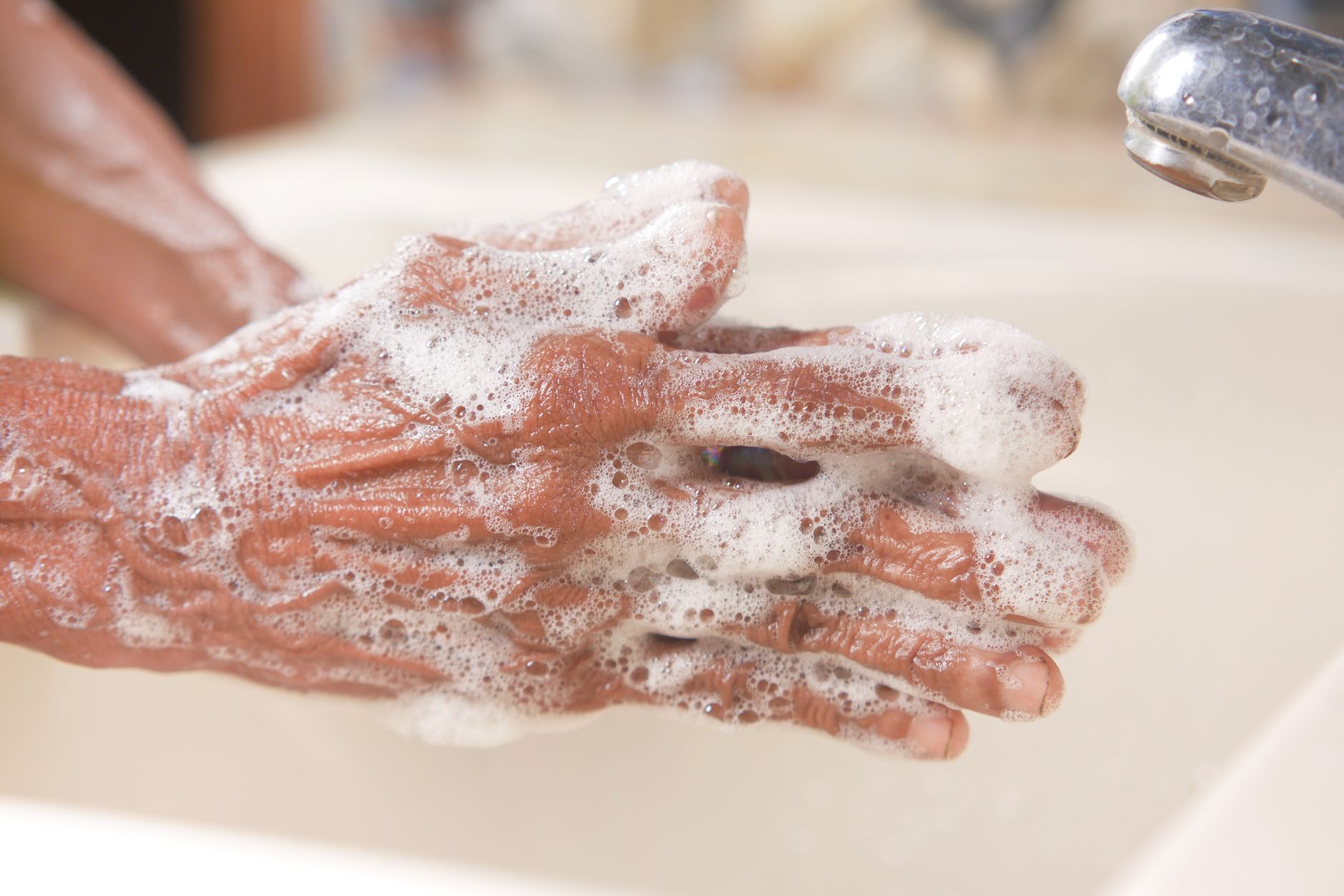 person washing hands hygiene